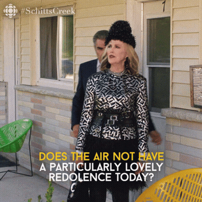 A Woman Standing In Front Of A House With The Words " Does The Air Not Have A Particularly Lovely Redolence Today " GIF