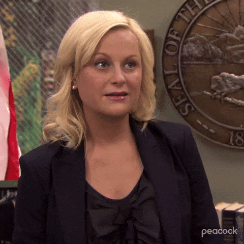 A Woman Standing In Front Of A Seal That Says ' State Of Washington ' GIF