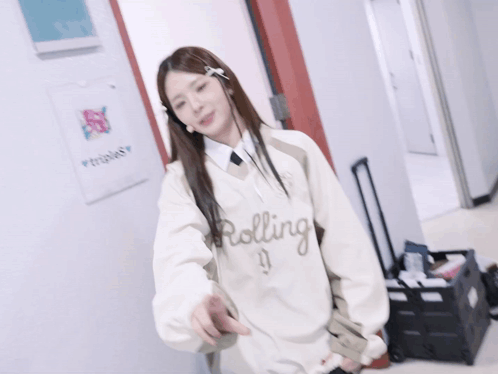 A Woman Standing In Front Of A Sign That Says Triples On It GIF