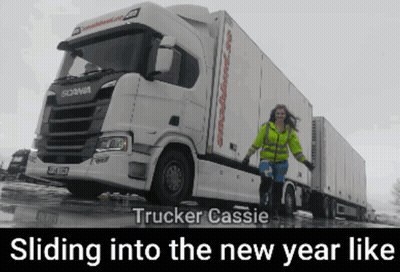 A Woman Standing In Front Of A White Scania Truck With The Caption Trucker Cassie Sliding Into The New Year Like GIF