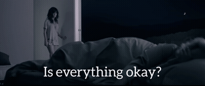 A Woman Standing Next To A Bed With The Words " Is Everything Okay " On The Bottom GIF