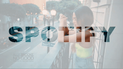 A Woman Standing On A Balcony With The Word Spotify On The Top GIF