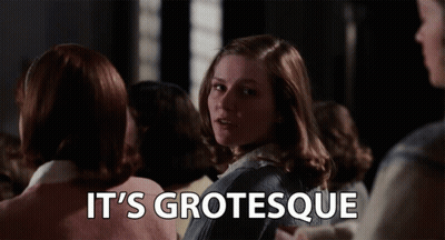 A Woman Stands In A Crowd With The Words " It 'S Grotesque " Above Her GIF