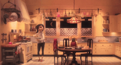 A Woman Stands In A Kitchen Holding A Bowl GIF