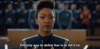 A Woman Stands In Front Of A Crowd And Says The Only Way To Defeat Fear Is To Tell It No GIF