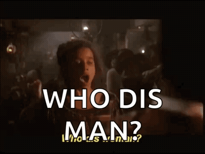 A Woman Stands In Front Of A Crowd And Says Who Dis Man ? GIF