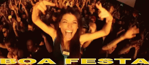 Woman Standing In Front Of Crowd With Boa Festa GIF