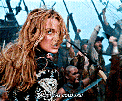 A Woman Stands In Front Of A Crowd With The Words Hoist The Colours GIF