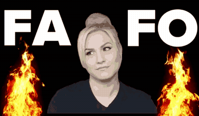 A Woman Stands In Front Of A Fire With The Words Fa Fo Behind Her GIF
