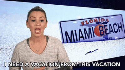 A Woman Stands In Front Of A Florida Miami Beach License Plate GIF