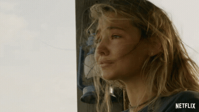 A Woman Stands In Front Of A Lantern With The Word Netflix On The Bottom Right GIF