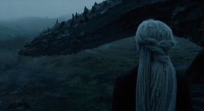 A Woman Stands In Front Of A Large Black Dragon With The Words Calm Below Her GIF