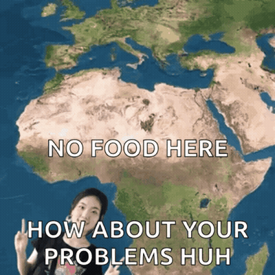 A Woman Stands In Front Of A Map Of The World With The Words No Food Here How About Your Problems Huh GIF