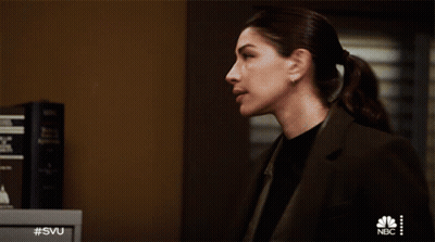 A Woman Stands In Front Of A Nbc Safe GIF