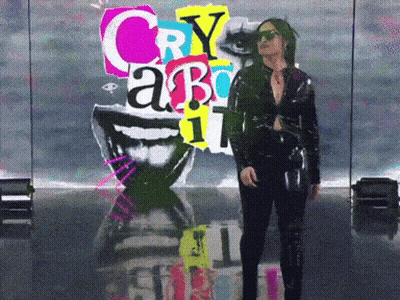 A Woman Stands In Front Of A Poster That Says Cry About GIF