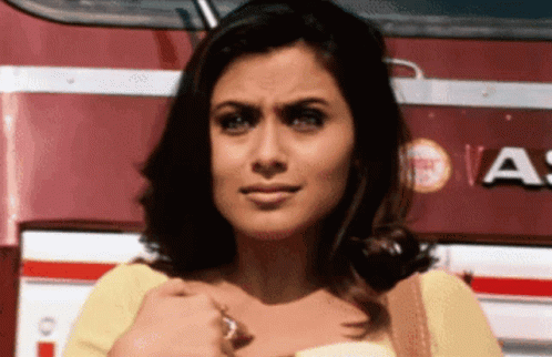 A Woman Stands In Front Of A Red And White Bus That Says A On It GIF