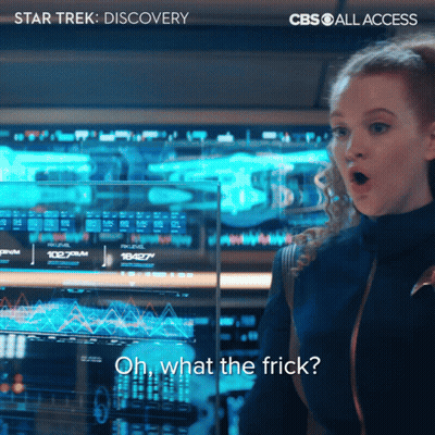 A Woman Stands In Front Of A Screen That Says Oh What The Frick On It GIF