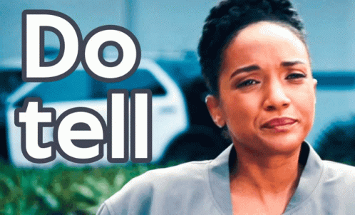 A Woman Stands In Front Of A Sign That Reads Do Tell GIF