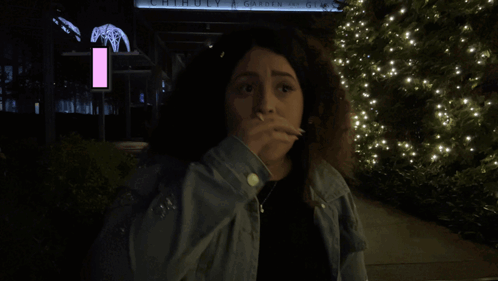 Woman Standing In Front Of Chihuly Garden Of Glass GIF