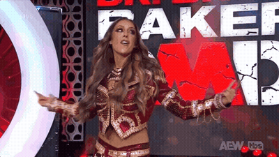 A Woman Stands In Front Of A Sign That Says Fake GIF