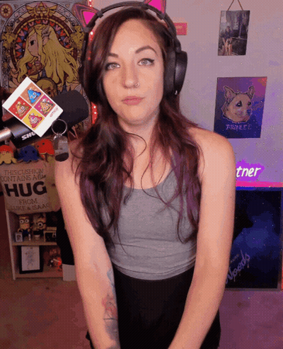 A Woman Stands In Front Of A Sign That Says " This Cushion Contains A Hug " GIF