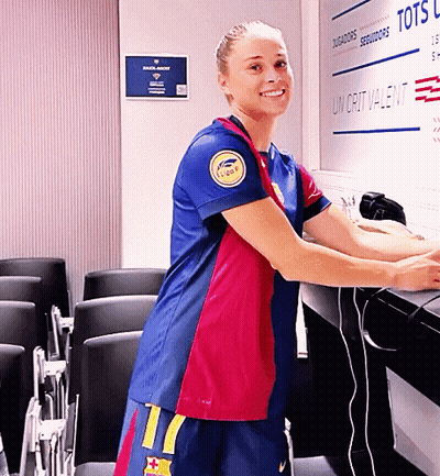 A Woman Stands In Front Of A Sign That Says Tots On It GIF