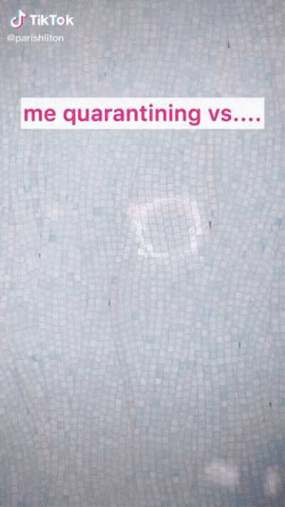 A Woman Stands In Front Of A Wall That Says " Me Quarantining Vs ... " GIF