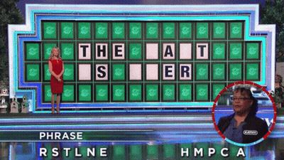 A Woman Stands In Front Of A Wheel Of Fortune Board That Says " The At " On It GIF