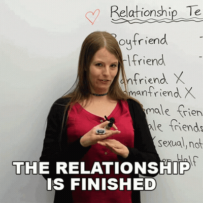 A Woman Stands In Front Of A White Board That Says Relationship Te GIF