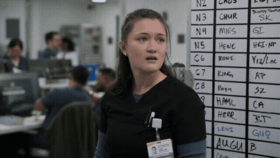 A Woman Stands In Front Of A White Board With The Letters N3 And Chur Written On It GIF