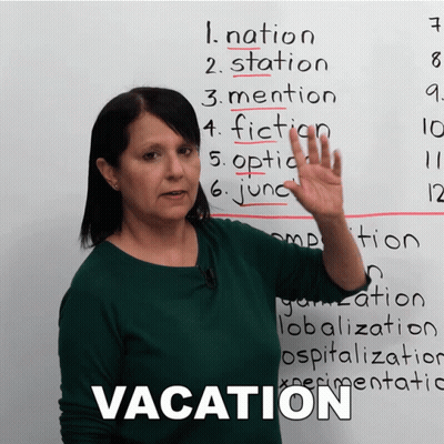 A Woman Stands In Front Of A White Board With The Word Vacation On It GIF