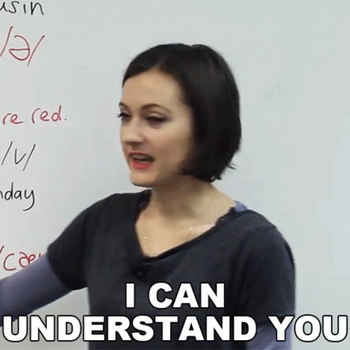 A Woman Stands In Front Of A White Board With The Words I Can Understand You Written On It GIF