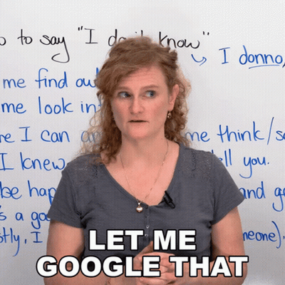 A Woman Stands In Front Of A White Board With The Words Let Me Google That Written On It GIF
