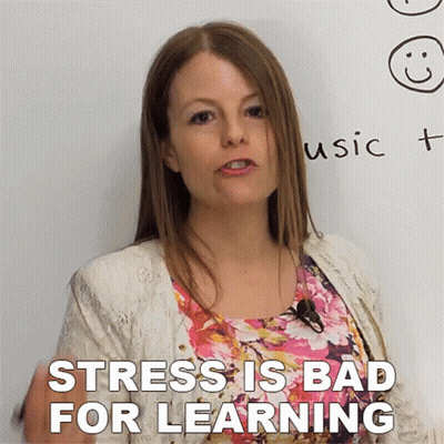 A Woman Stands In Front Of A White Board With The Words " Stress Is Bad For Learning " GIF