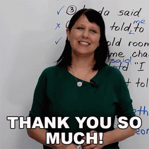 A Woman Stands In Front Of A White Board With The Words Thank You So Much GIF