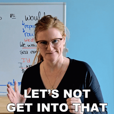 A Woman Stands In Front Of A Whiteboard With The Words Let 'S Not Get Into That Written On It GIF