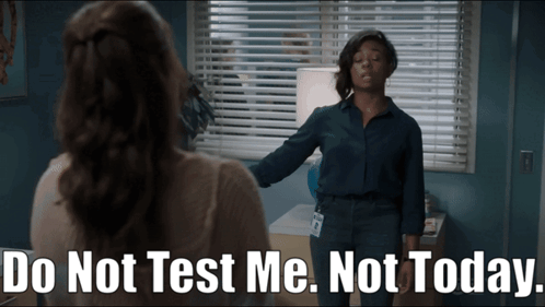 A Woman Stands In Front Of A Window With Blinds And Says Do Not Test Me Not Today GIF