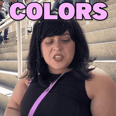 A Woman Stands In Front Of Stairs With The Word Colors Above Her Head GIF