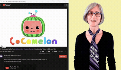 A Woman Stands Next To A Cocomelon Video GIF