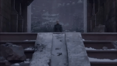 A Woman Stands On A Set Of Stairs In Front Of A Large Window GIF