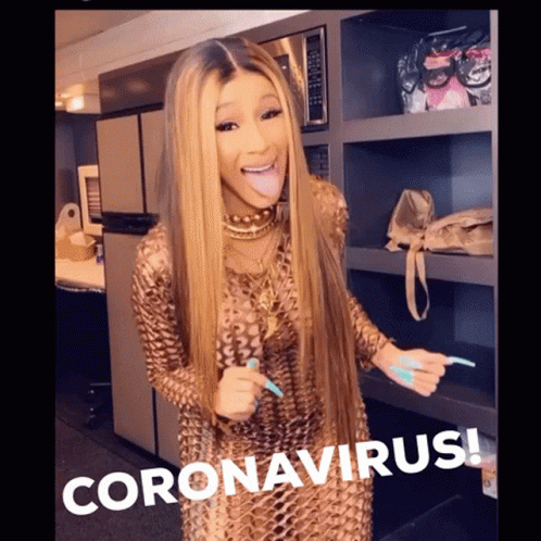 A Woman Sticking Her Tongue Out In Front Of A Sign That Says Coronavirus On It GIF