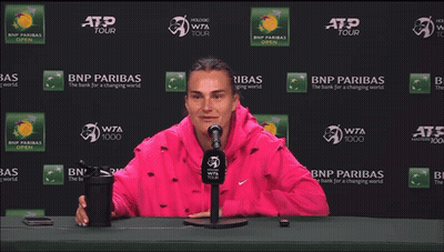 A Woman Stretches Her Leg In Front Of A Bnp Paribas Ad GIF