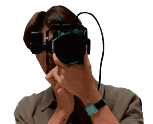 A Woman Taking A Picture With A Canon Camera Sticker