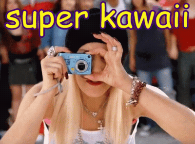 A Woman Taking A Picture With The Words Super Kawaii Written Above Her GIF