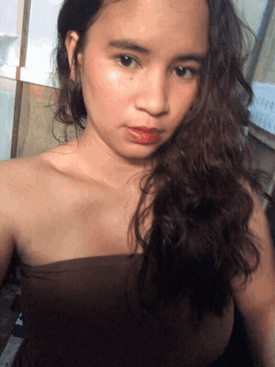 A Woman Taking A Selfie In Front Of A Calendar That Says ' October ' On It GIF