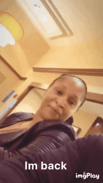 A Woman Taking A Selfie With The Words Im Back On The Bottom GIF