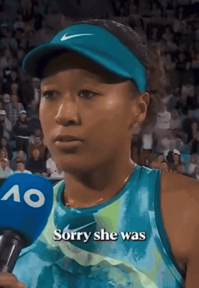 A Woman Talking Into A Microphone With The Words " Sorry She Was " On It GIF
