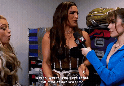 A Woman Talking Into A Microphone With The Words Water Water You Guys Think I 'M Mad About Water Written Below Her GIF