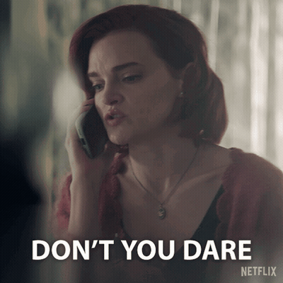 A Woman Talking On A Cell Phone With A Netflix Logo Behind Her GIF