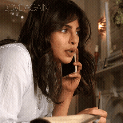 A Woman Talking On A Cell Phone With Love Again Written On The Bottom Right GIF